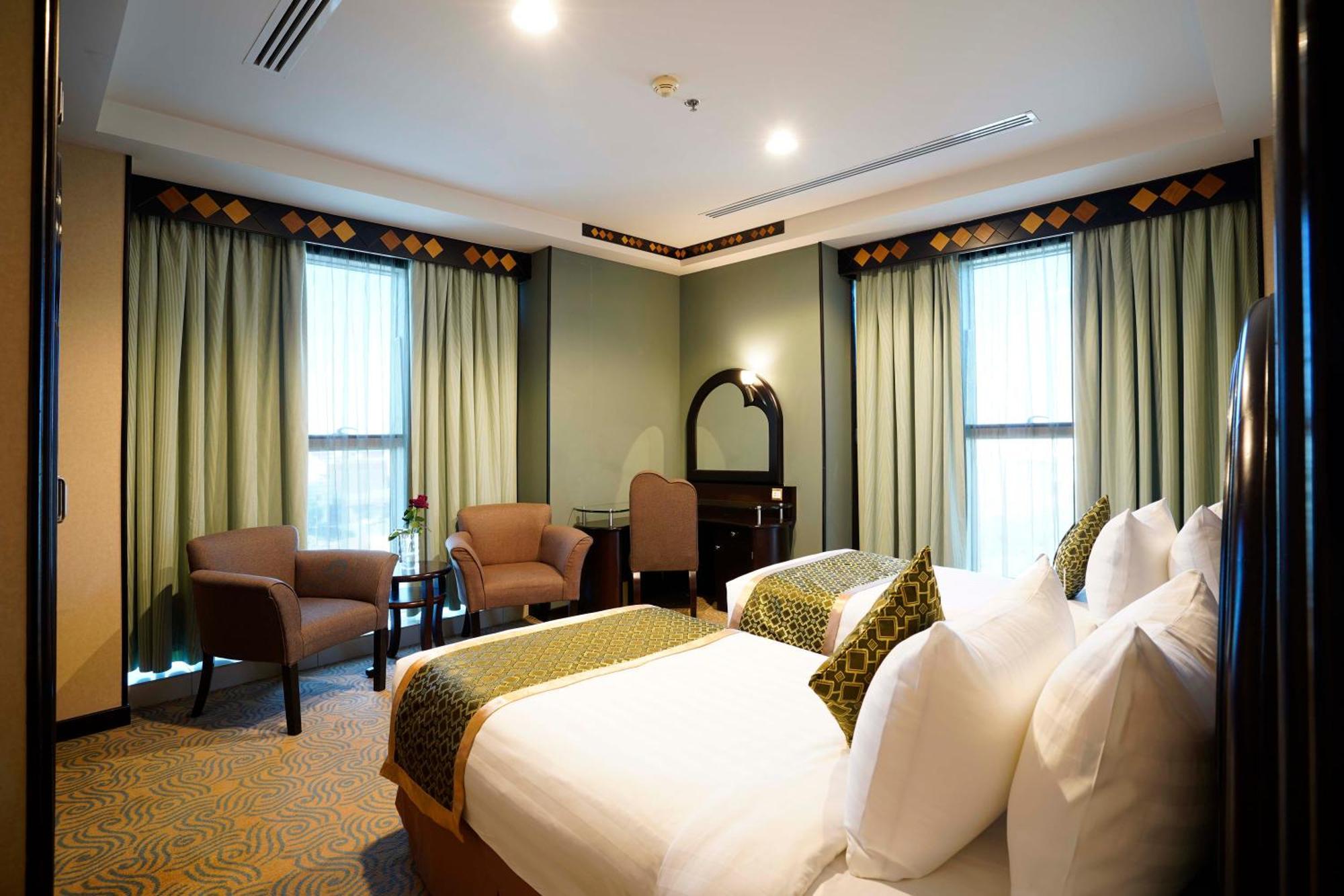 Awaliv International Hotel Ta'if Quarto foto A bedroom at the hotel